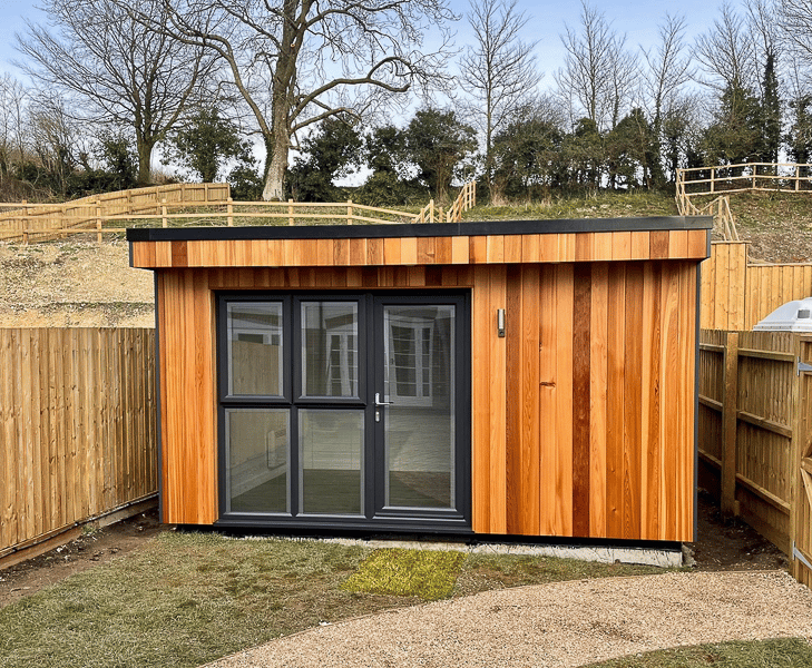Garden office by Executive Garden Rooms with Cedar front wall and Cedral on the hidden elevations