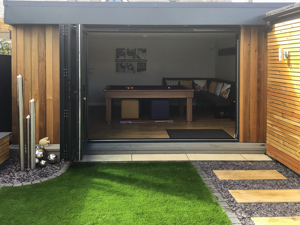 Bi-fold doors fold back to create a free flowing indoor outdoor space