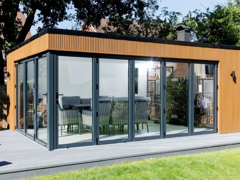 Miniature Manors garden room with composite cladding