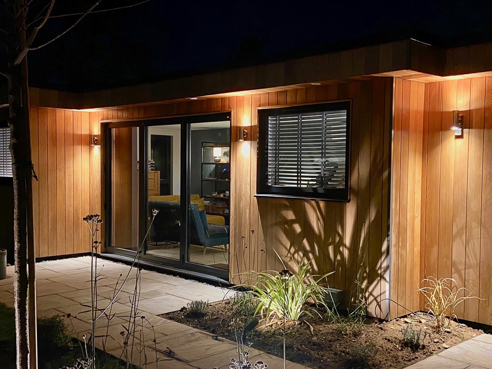 35sqm bespoke design by Executive Garden Rooms shown here at night with the exterior lighting on