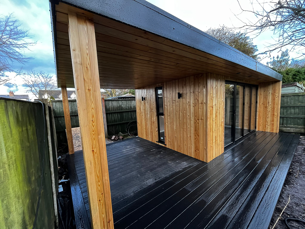 4.5m x 3.3m Heritage Garden Studios building for use as a garden dining room with an open-sided covered area for a hot tub.