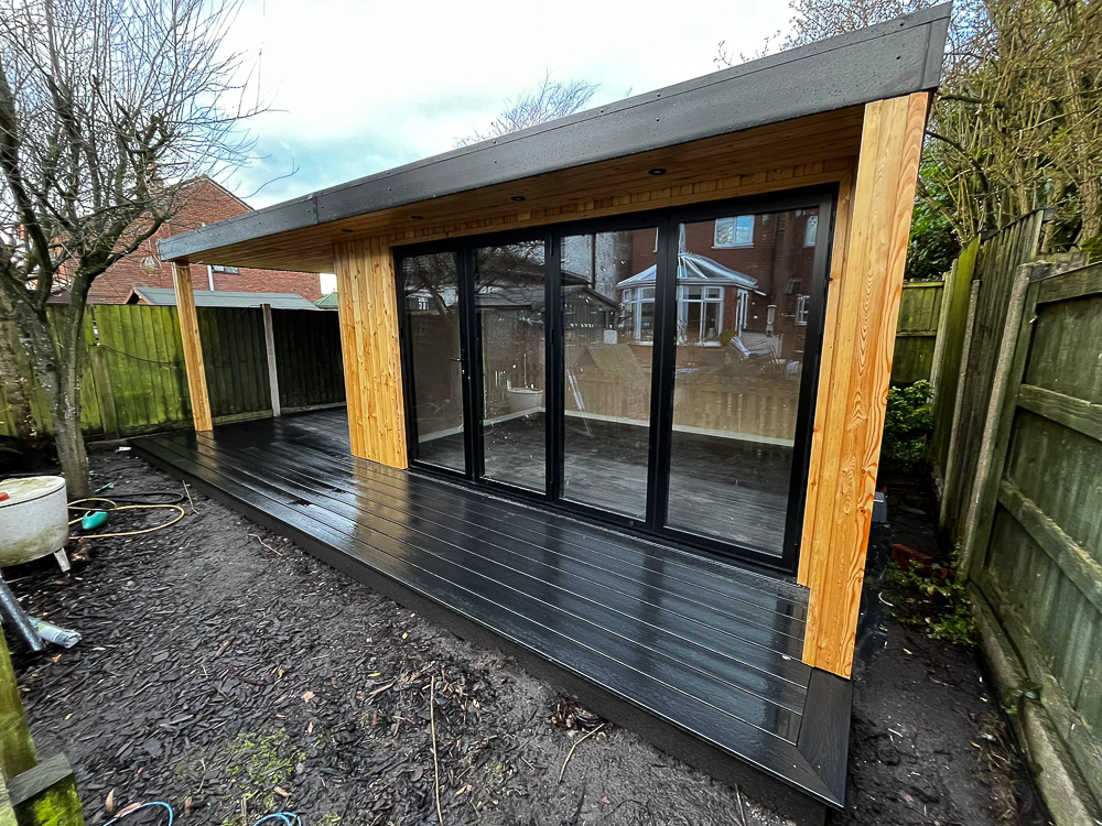 4.5m x 3.3m Heritage Garden Studios building for use as a garden dining room with an open-sided covered area for a hot tub.