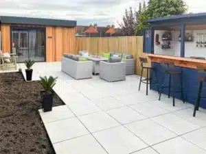 The annexe leads out onto the family garden complete with bar
