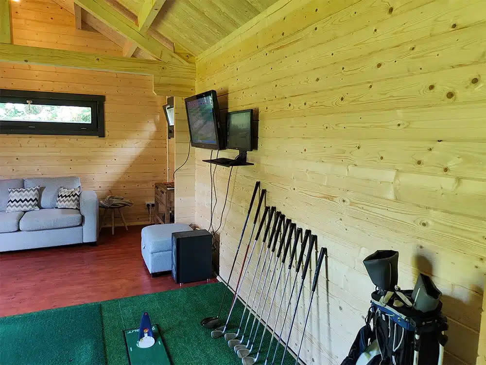 A bar and seating area sit at one end of the garden golf room