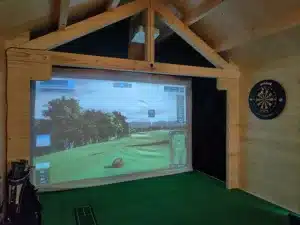 The golf simulator screen sits in the end of the 4m wide garden room