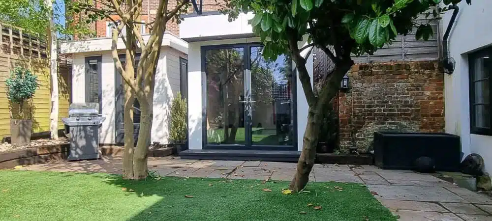 The L-shaped garden gym slots in beside an existing garden office