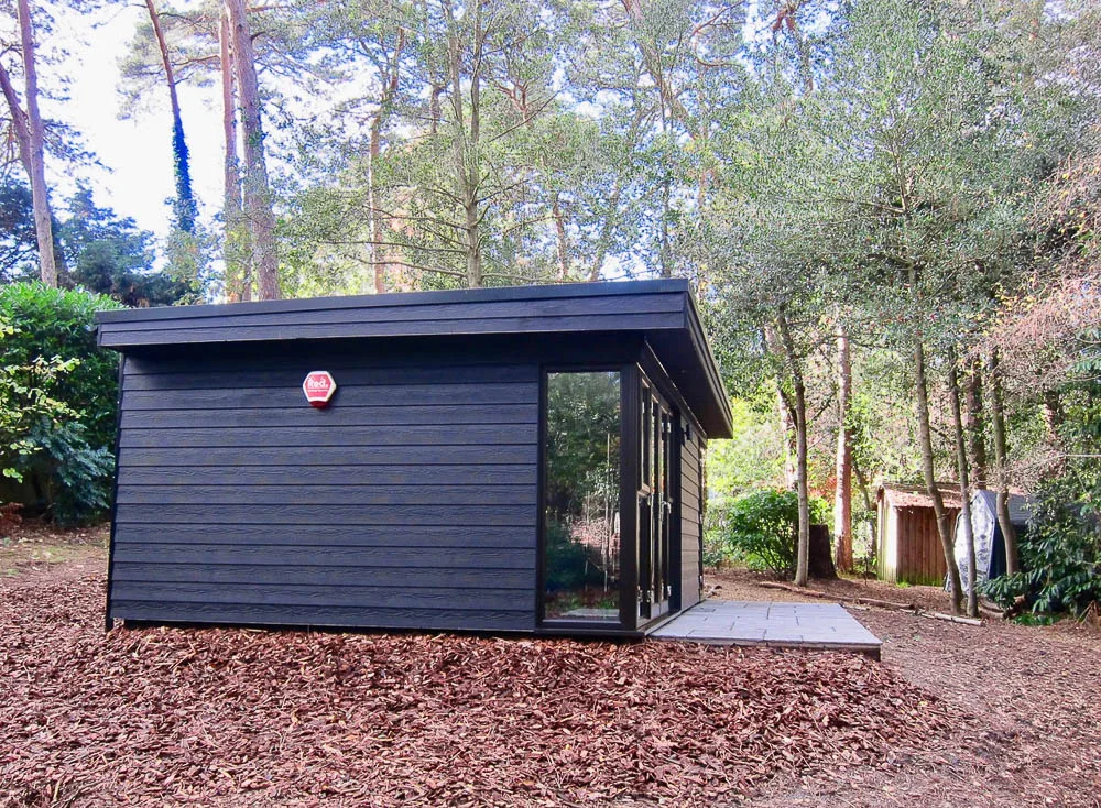 The garden rooms have been clad in black Cedral cladding
