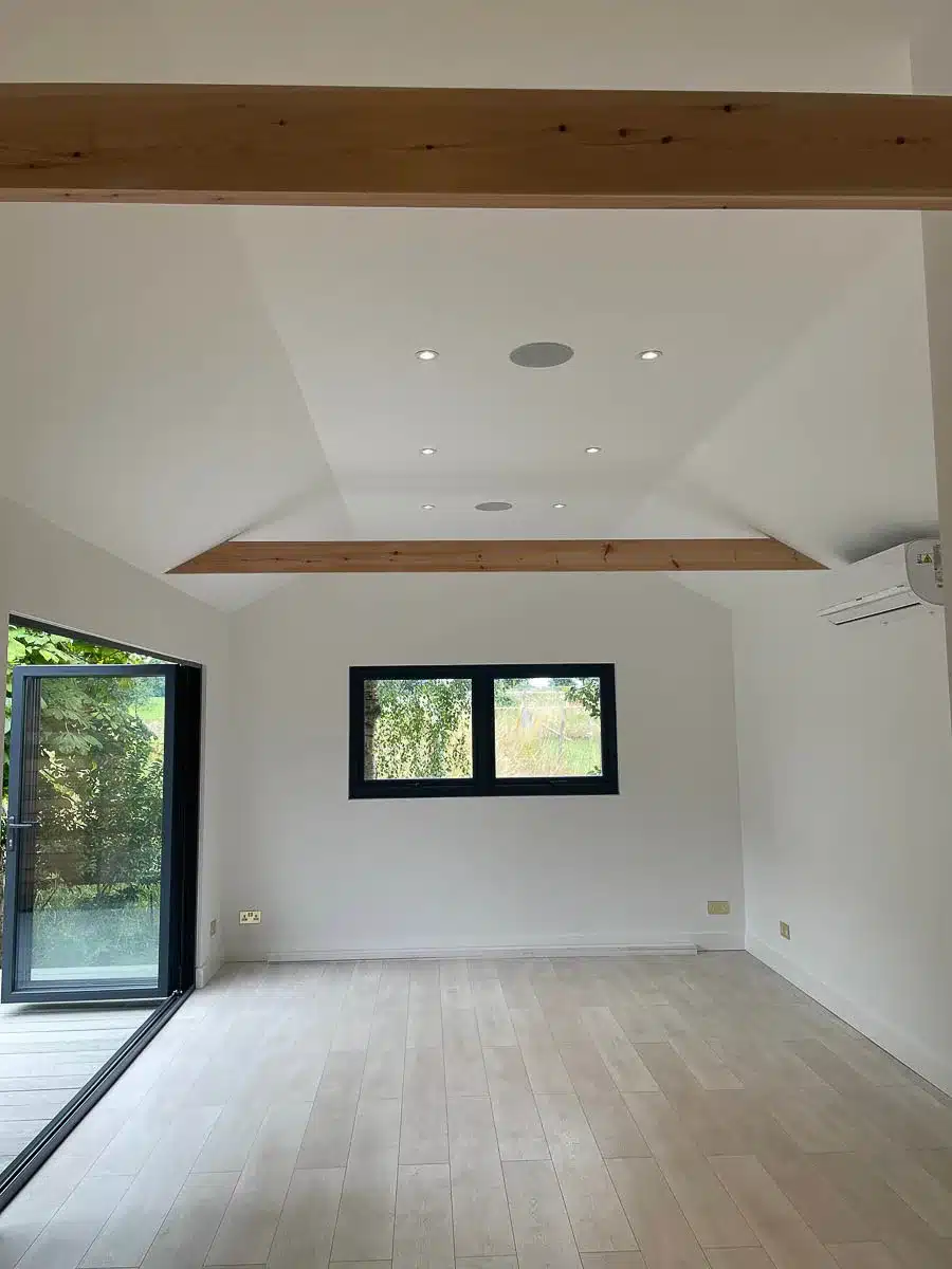 The gym by Ark Design Build has a vaulted ceiling