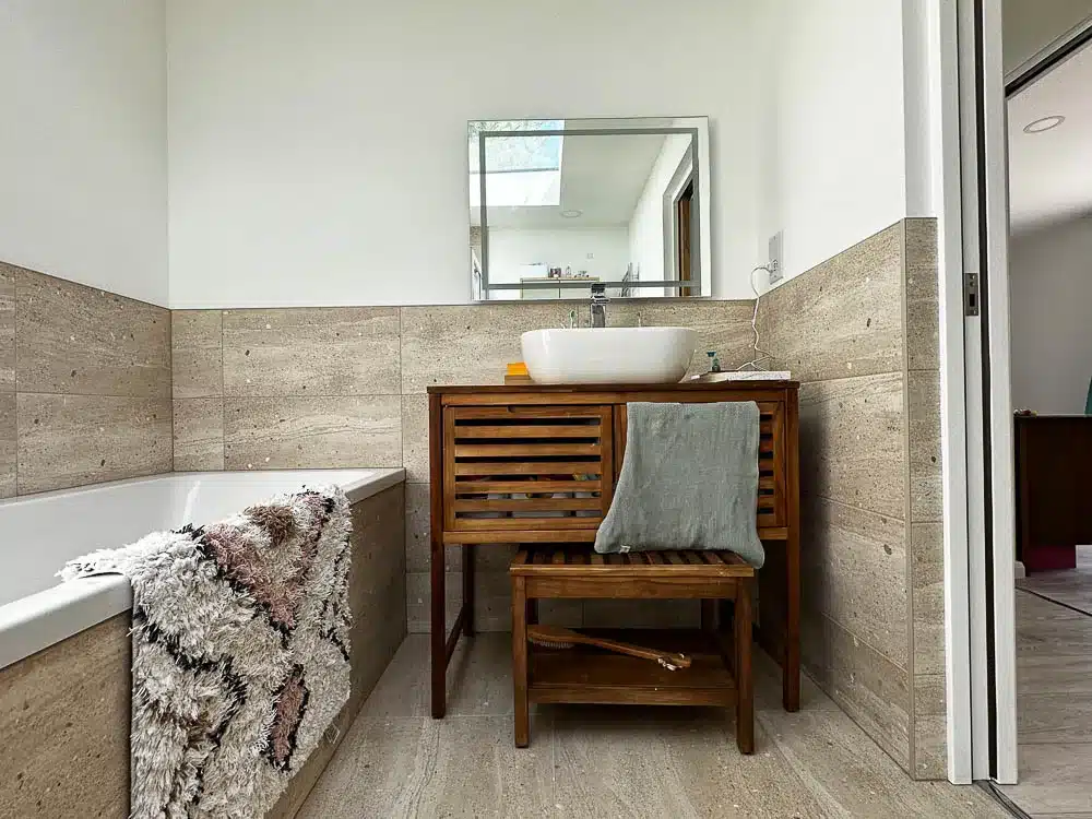 The family bathroom features both a bath and a shower