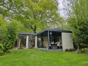 L-shaped office and gym with covered seating area by Cosy Garden Rooms