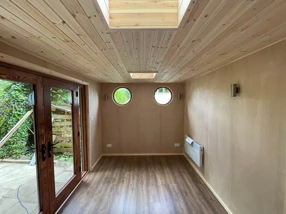 Inside the room has a contemporary cabin aesthetic.