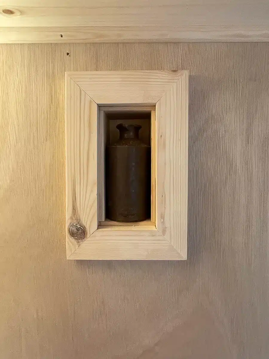 A special nook was created to frame a old bottle found during the build