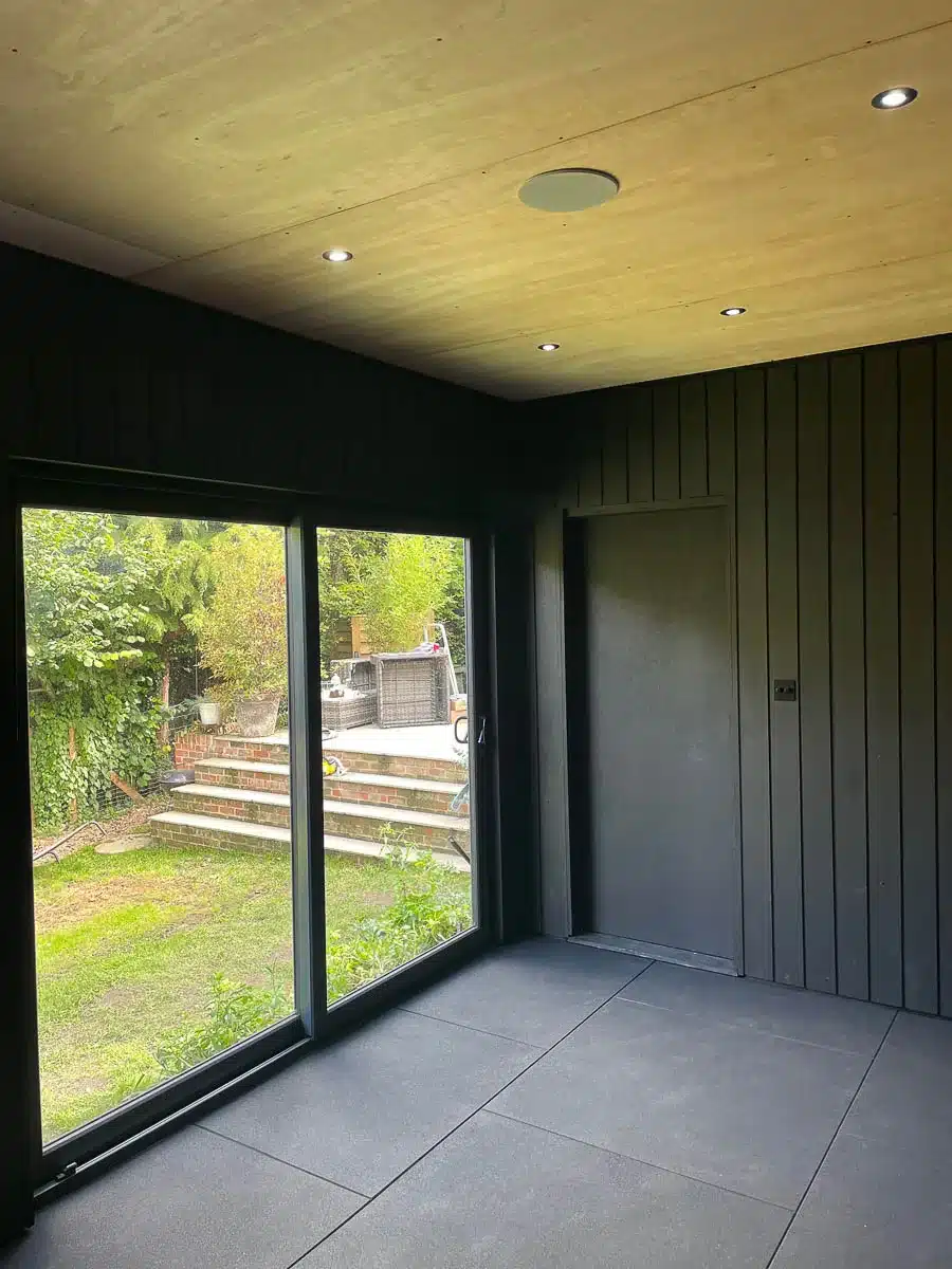 Inside, black Thermowood cladding has been paired with plywood
