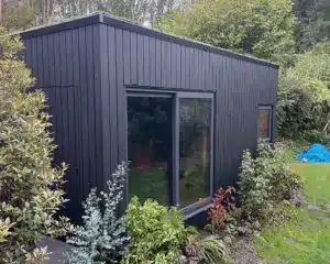The exterior has been finished with black Thermowood cladding