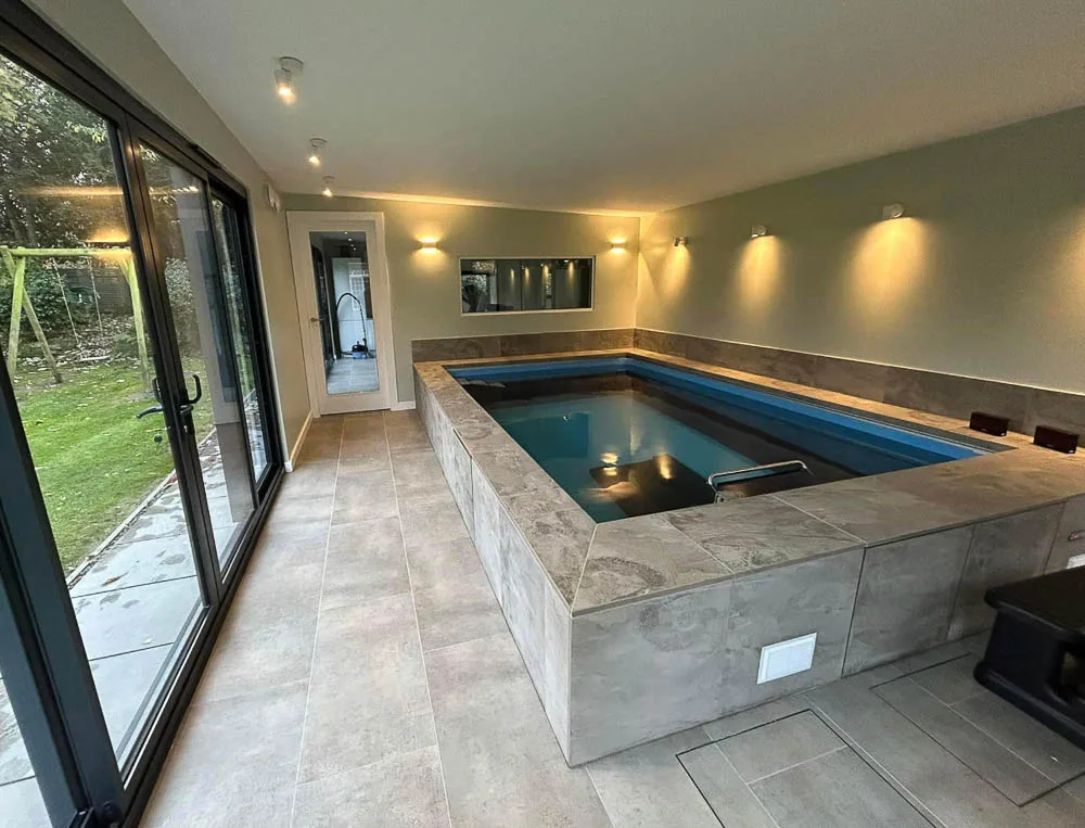 Infinity pool with underwater treadmill by Hargreaves Garden Spaces