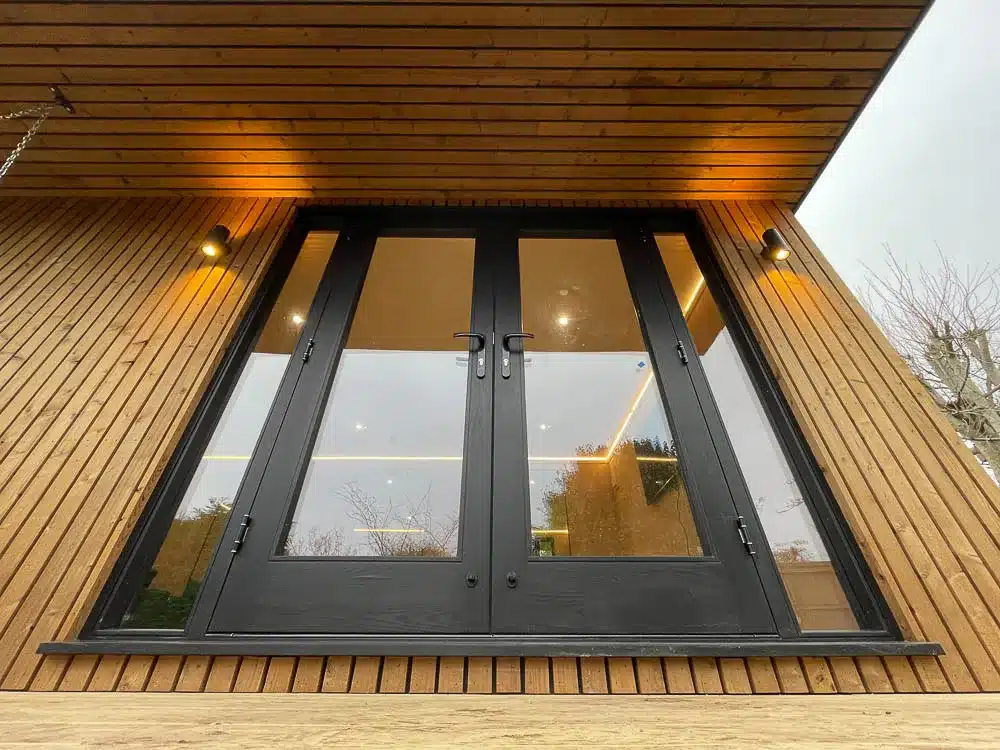 The garden studio features French doors