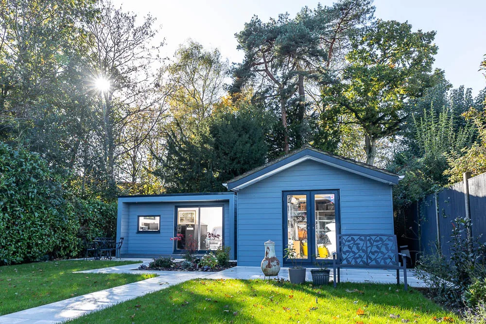 The old garage and new garden office boast the same exterior finishes