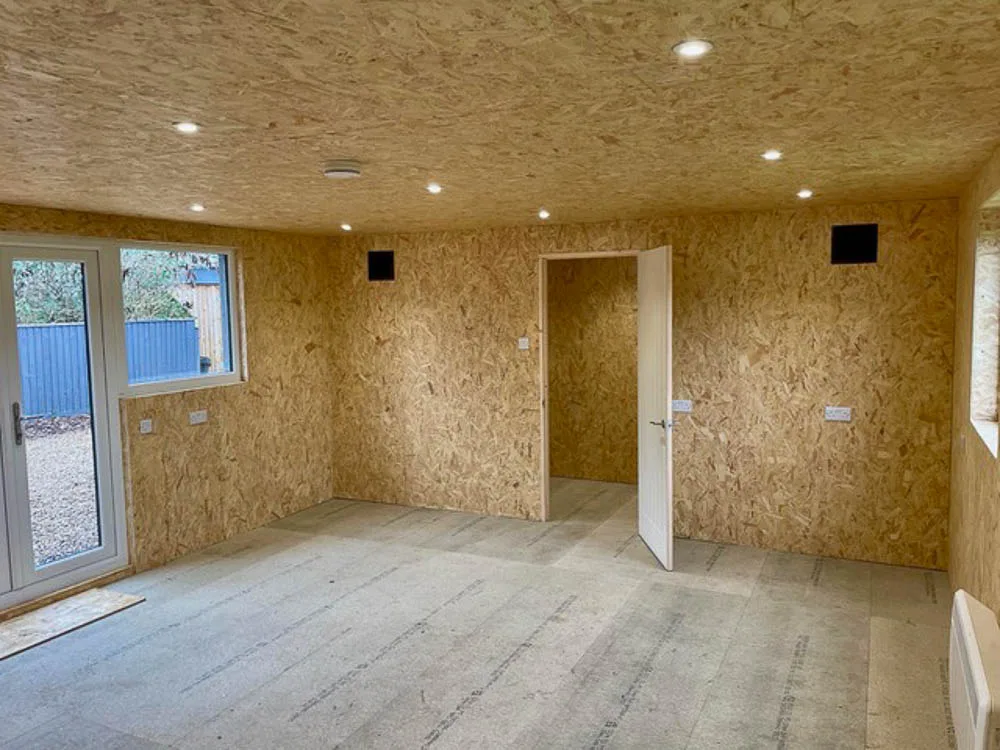 Insulated garden workshop with storage room by Executive Garden Rooms