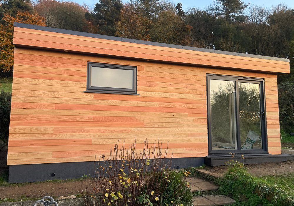 Douglas Fir cladding has been fitted horizontally