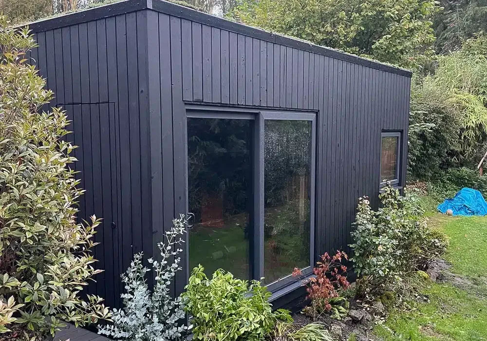 The exterior has been finished with black Thermowood cladding