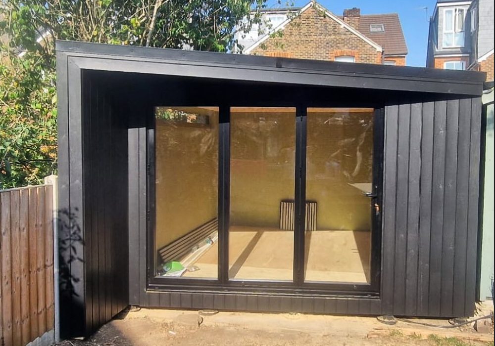 Garden room with an angled roof canopy by Garden2Office