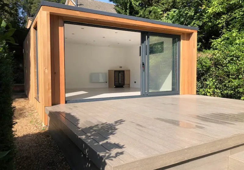 Cedar garden room with hidden shed by Ark Design Build