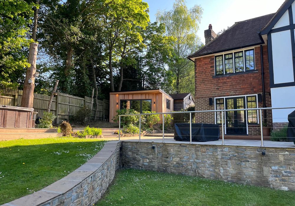 The garden room gym sits well in the garden to the side of the house