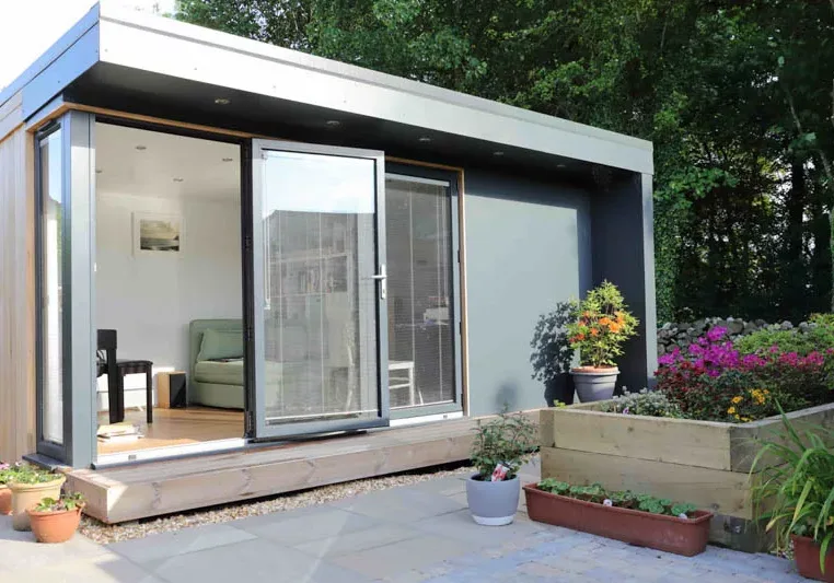 Grey Trespa & Cedar have been mixed together on the exterior of this garden room