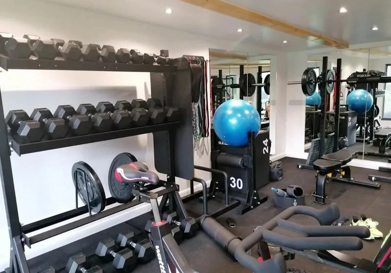 Garden gym with reinforced floor by Bridge Garden Rooms