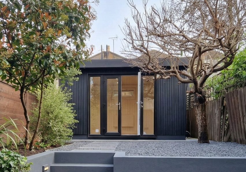 The finished garden room with its black slatted cladding chosen to replicate the finish on the kitchen extension