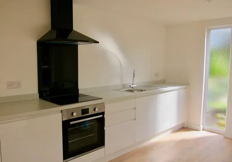 The kitchenette includes integrated appliances