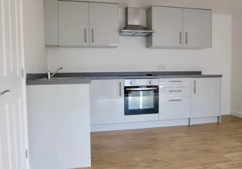 The garden annexe has a well equipped kitchen with high gloss units