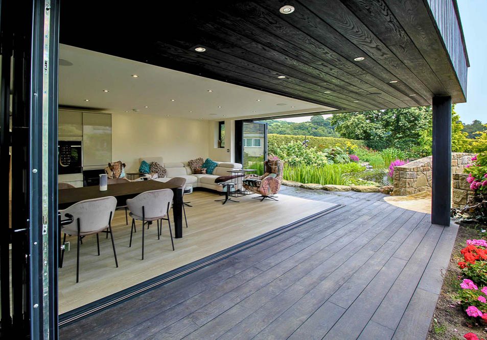 Two sets of bi-folds allow the corner of the room to be opened out onto the garden