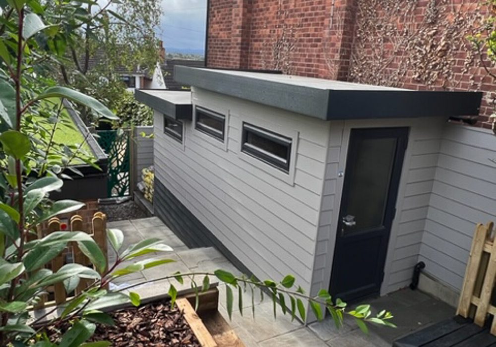5.6m x 1.6m insulated garden room attached to the side of the house