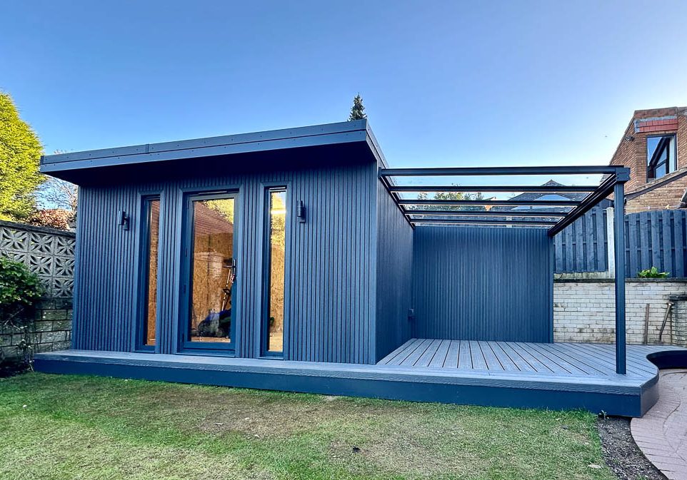 The exterior of the garden room has been clad with slatted composite cladding with colour matched decking
