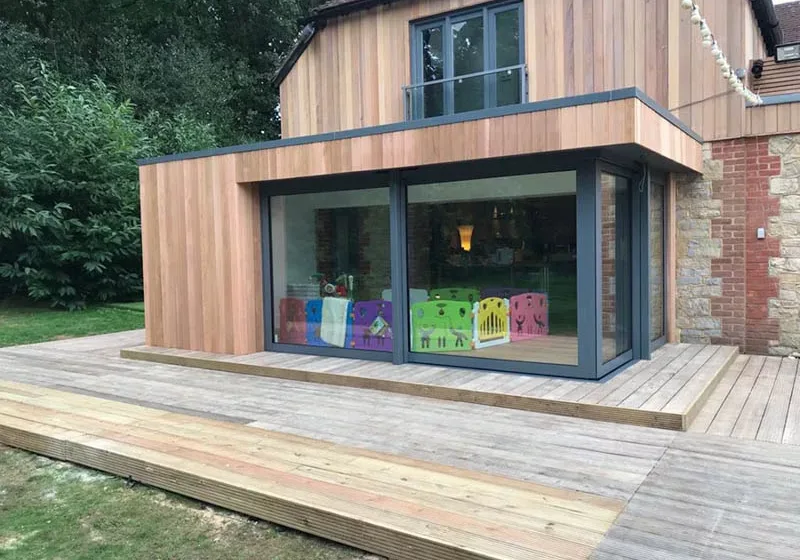 Cedar clad kitchen extension by Garden Spaces