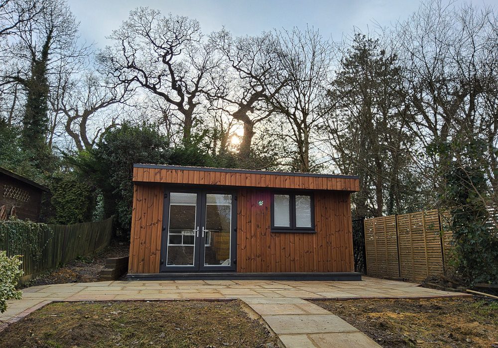The Thermowood cladding has been fixed vertically and pairs well with the Anthracite Grey door and windows