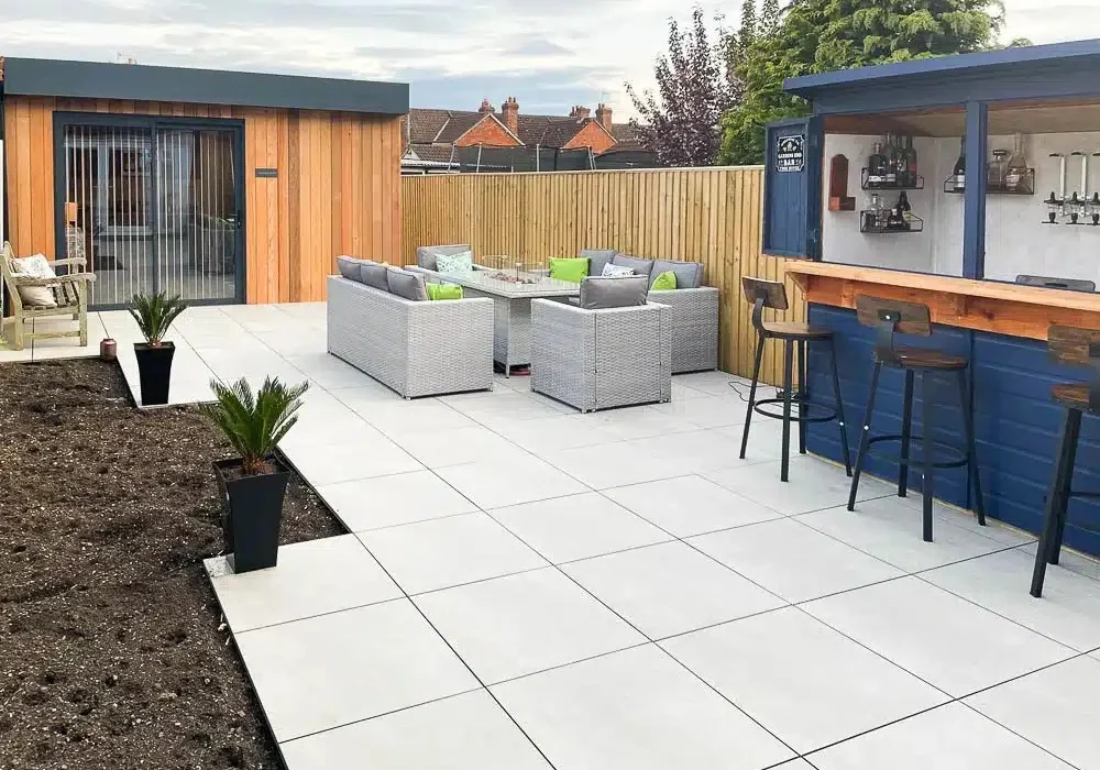 The annexe leads out onto the family garden complete with bar