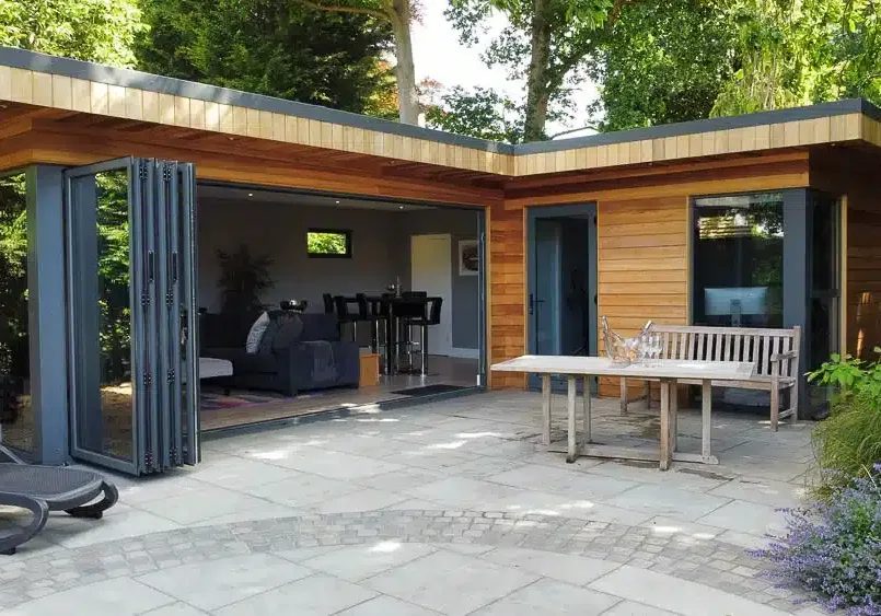 L-shaped garden office and entertainment room with bathroom and kitchen