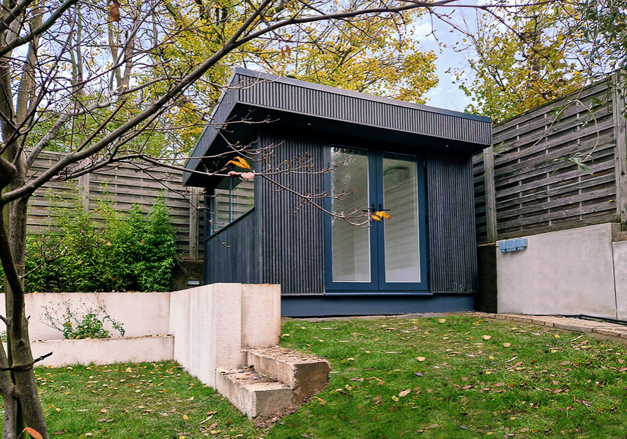 3.6m x 3.8m with composite, vertical slatted cladding by Garden Spaces