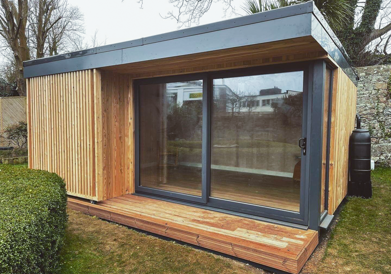 Garden room with sliding sun screen by Bridge Garden Rooms