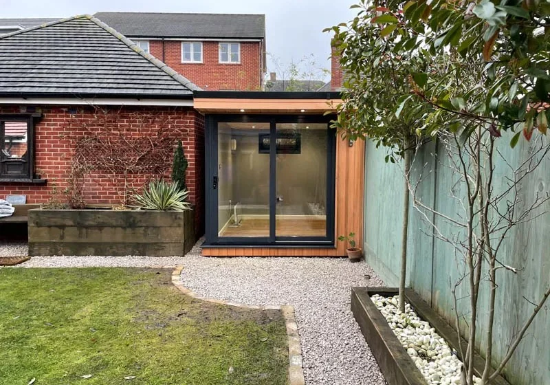 HG Spaces garden office beside a garage
