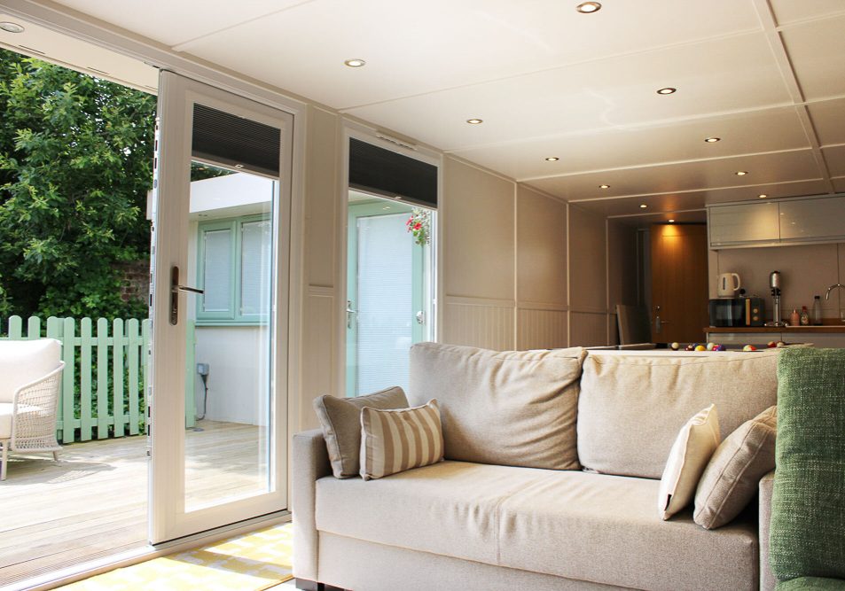 The main room features a comfortable living space, kitchen and bathroom