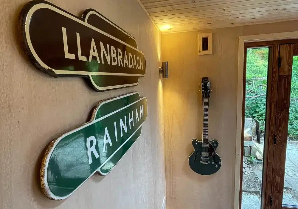 Inside the room has a contemporary cabin aesthetic.