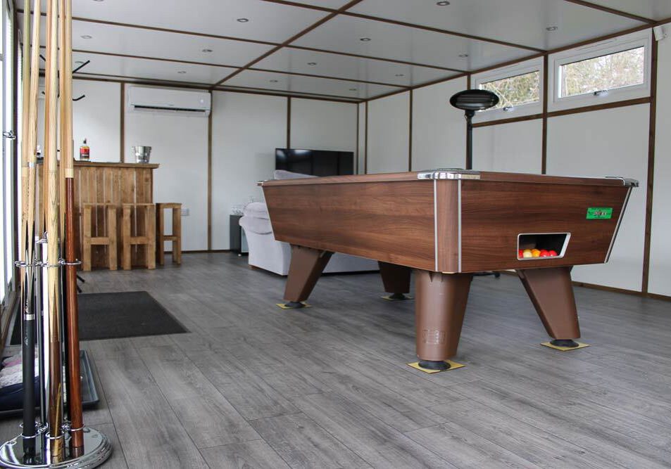 Inside, there is room for a full sized pool table, a sofa and bar.