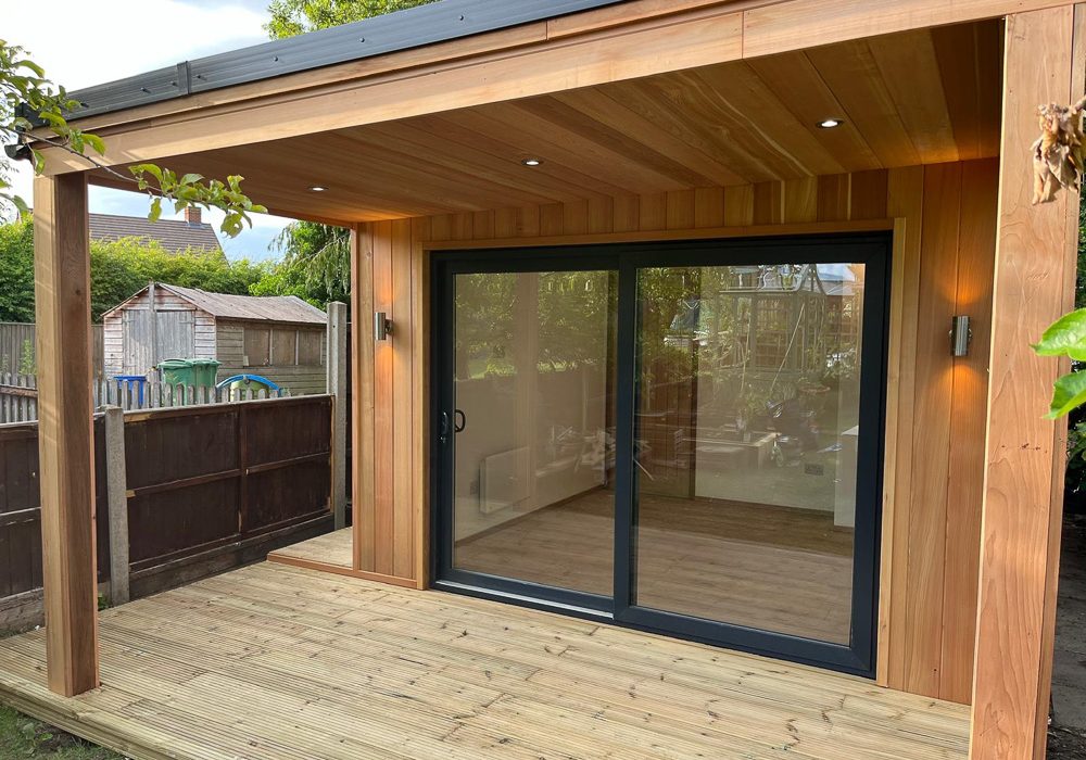 The front elevation and covered deck area have been finished in Western Red Cedar