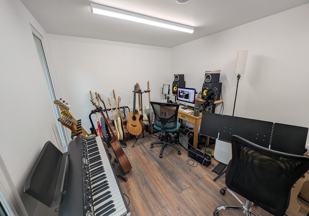 The music room is plastered and decorated with surface mounted electrics