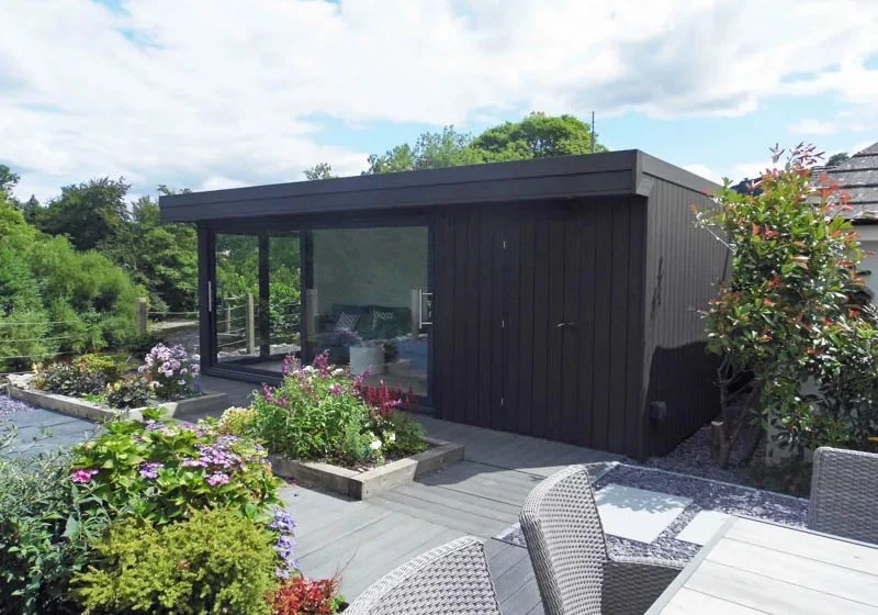 The black colour palette has created a striking building, sitting in a beautiful landscape.