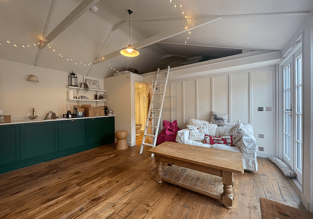 Teenagers den with kitchen, shower room and sleeping deck
