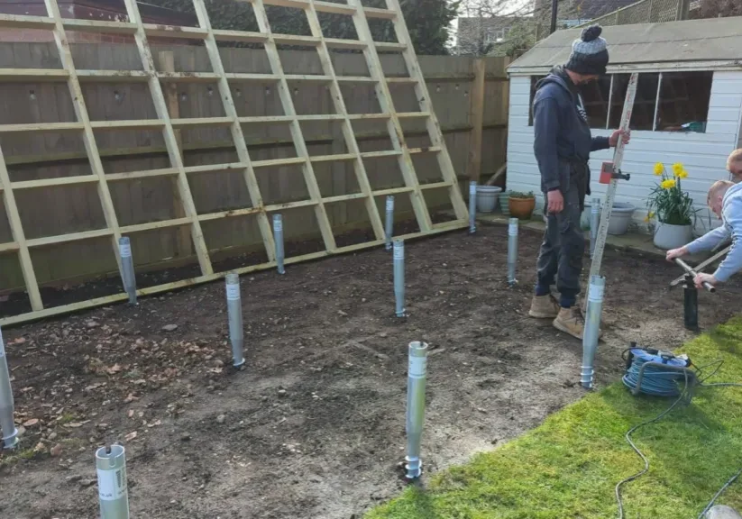 The Warwick Buildings team install the foundations as part of the garden room installation process